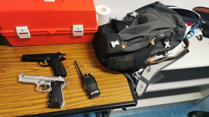 Reporter carrying toy guns charged with possessing imitation firearms