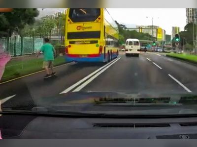 Viral video of skateboarder tailgating bus leads to Hong Kong man’s arrest