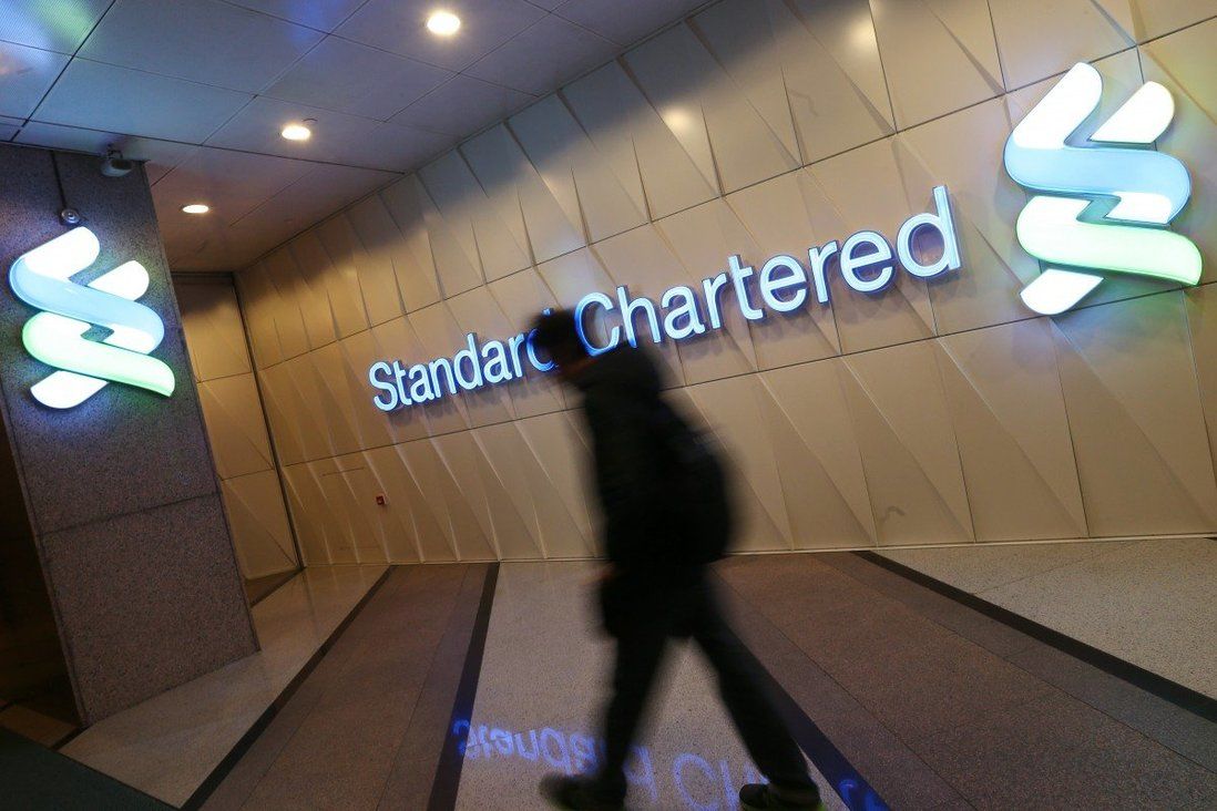 Standard Chartered sees profit more than double, resumes interim dividend