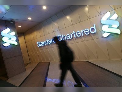 Standard Chartered sees profit more than double, resumes interim dividend