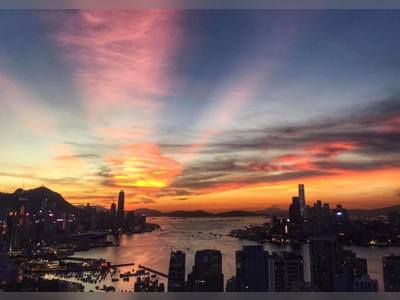 (Central Station) Colorful rays light up Hong Kong sky