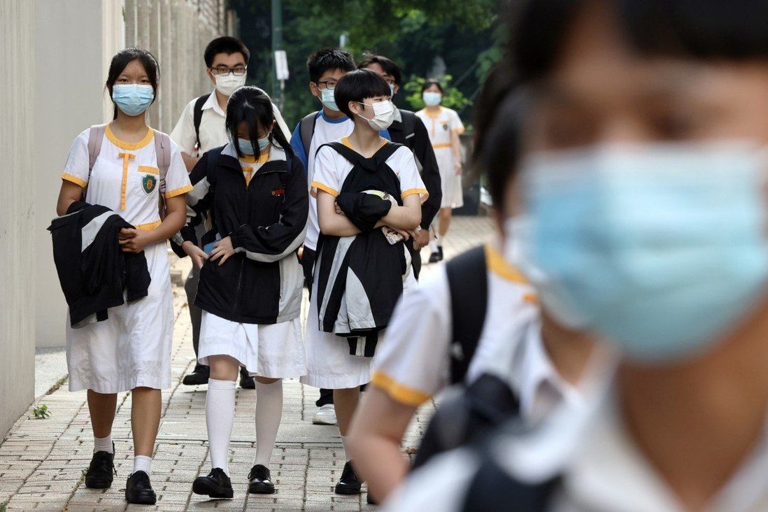 Hong Kong school is first to resume full-day classes after hitting jabs target