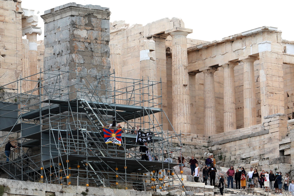 Exiled HK activist arrested in Athens for hanging banner from the Acropolis