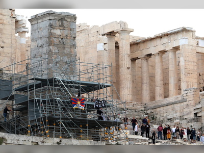 Exiled HK activist arrested in Athens for hanging banner from the Acropolis