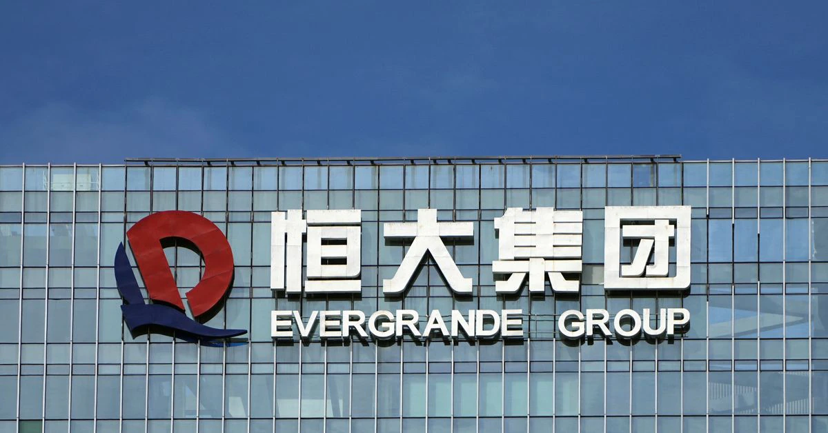 China Evergrande's EV unit shares surge on business shift, Evergrande sinks