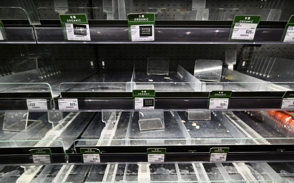 Emptied supermarket shelves await severe tropical storm Kompasu