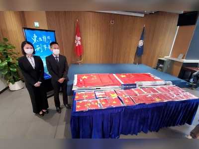 Man arrested for burning China's flags on National Day