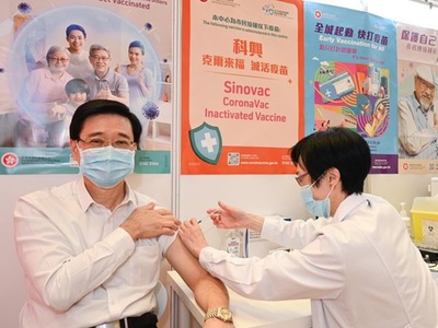 John Lee gets third dose of Sinovac vaccine