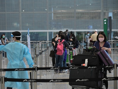 HK sees five Omicron cases, bans Cathay flights from New York