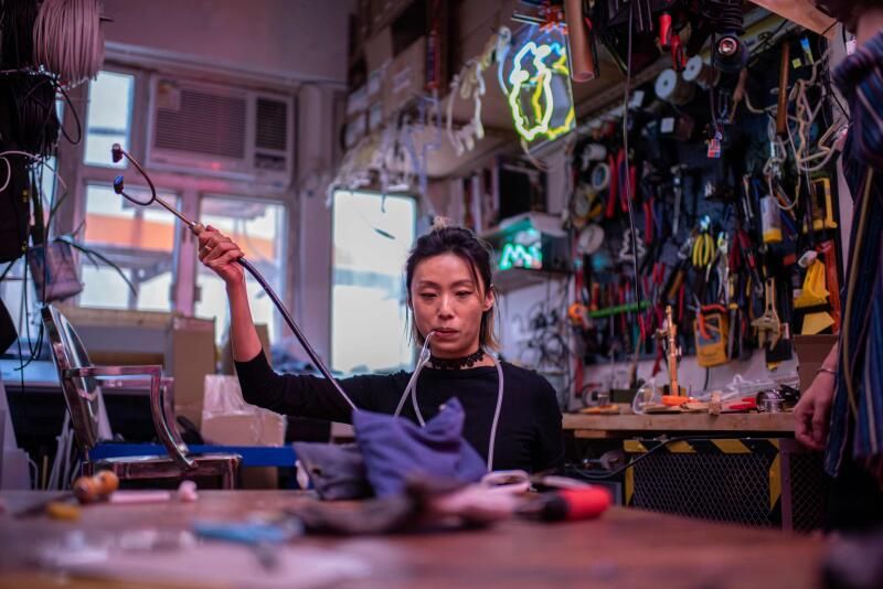 Hong Kong's young 'neon nomads' keep dying trade flickering