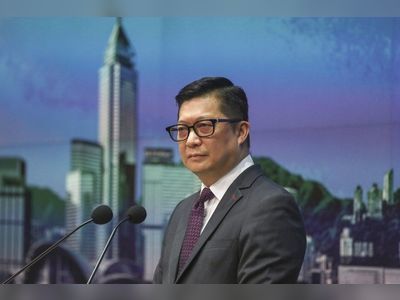 Hong Kong security chief calls fugitive ex-lawmaker ‘coward’ and ‘traitor’