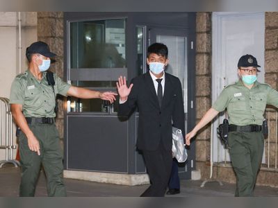 Hong Kong activist back in custody after court finds bail breach