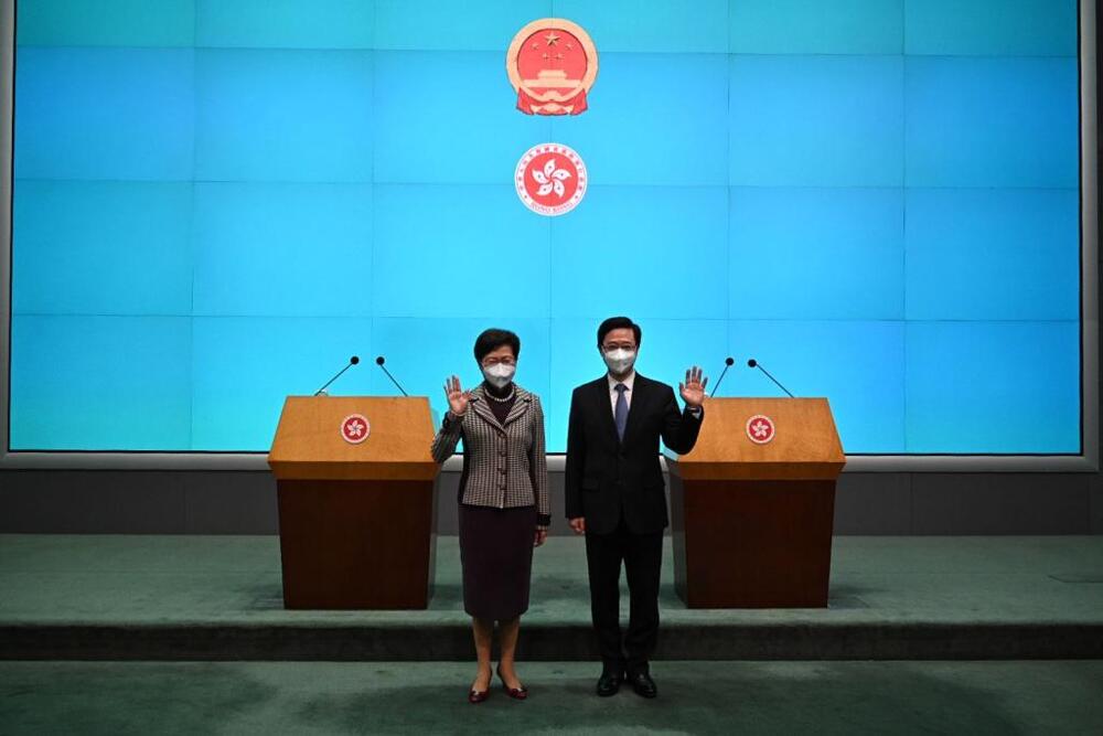 Carrie Lam pledges steady handover after meeting John Lee