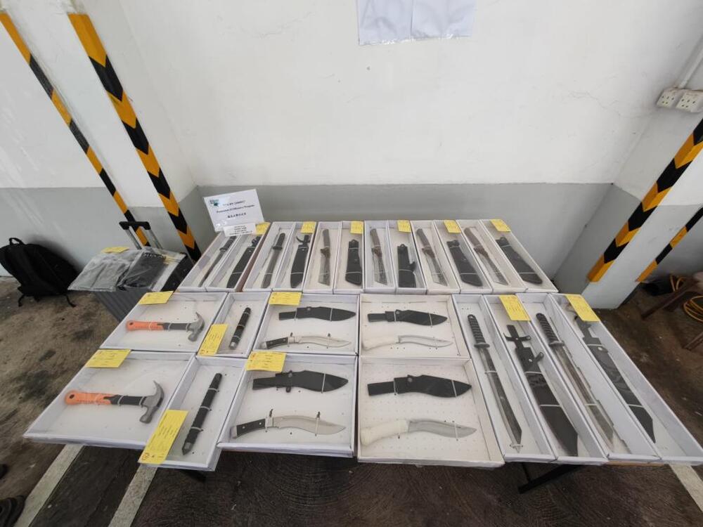 Three arrested after police bust hidden triad armory in Kwun Tong