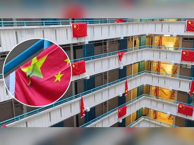 Twelve national flags defiled in Ping Shek Estate