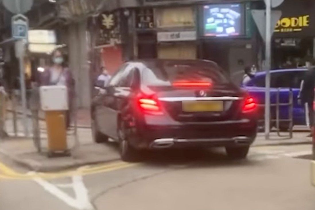 Hong Kong man charged after online video shows car crossing safety island