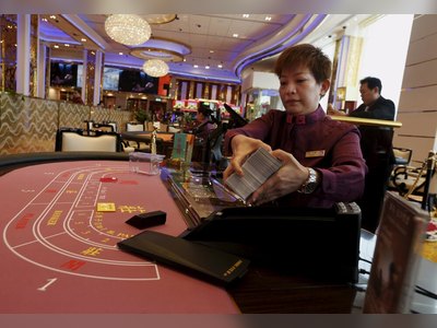 Macau sets first formal cap on casino tables, income amid bidding war