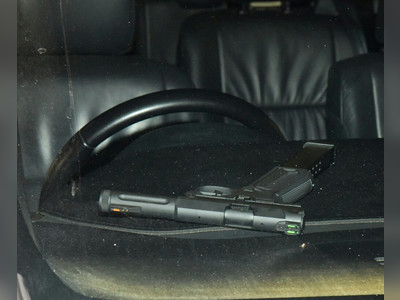 Trio arrested in Mong Kok after being spotted spinning gun in car