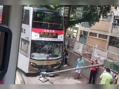 12 people injured after Hong Kong bus hits teenage pedestrian, metal pole