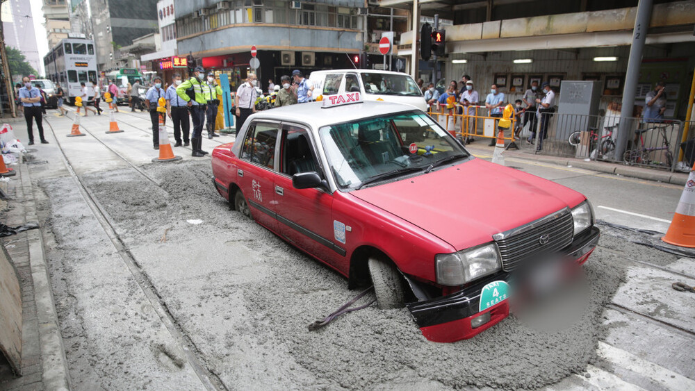 Taxi trapped in cement in Kennedy Town amuses netizens