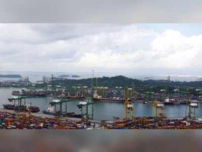 Economists cut Singapore growth forecasts, raise inflation - survey