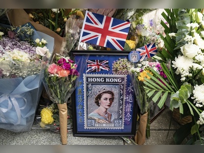Pictures: In Hong Kong, public grief over Queen doubles as dissent