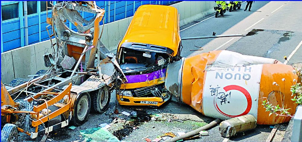 Driver dies as cement mixer shoots off flyover, crashes into school bus