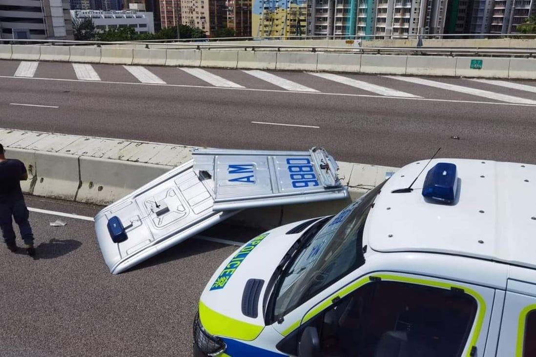 Hong Kong police van’s roof panel flies off, injuring taxi driver