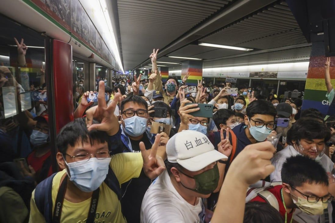 Hong Kong rail fans flock to take first passenger rides on new Q-train