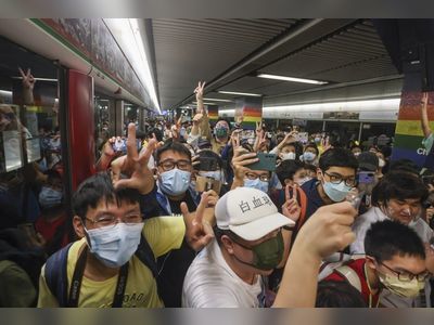 Hong Kong rail fans flock to take first passenger rides on new Q-train