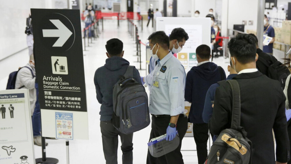 Japan says arrivals from China, HK and Macau will be limited to four airports