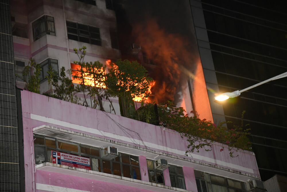 Suspicious Wan Chai fire leaves father and son dead, one with stab wounds