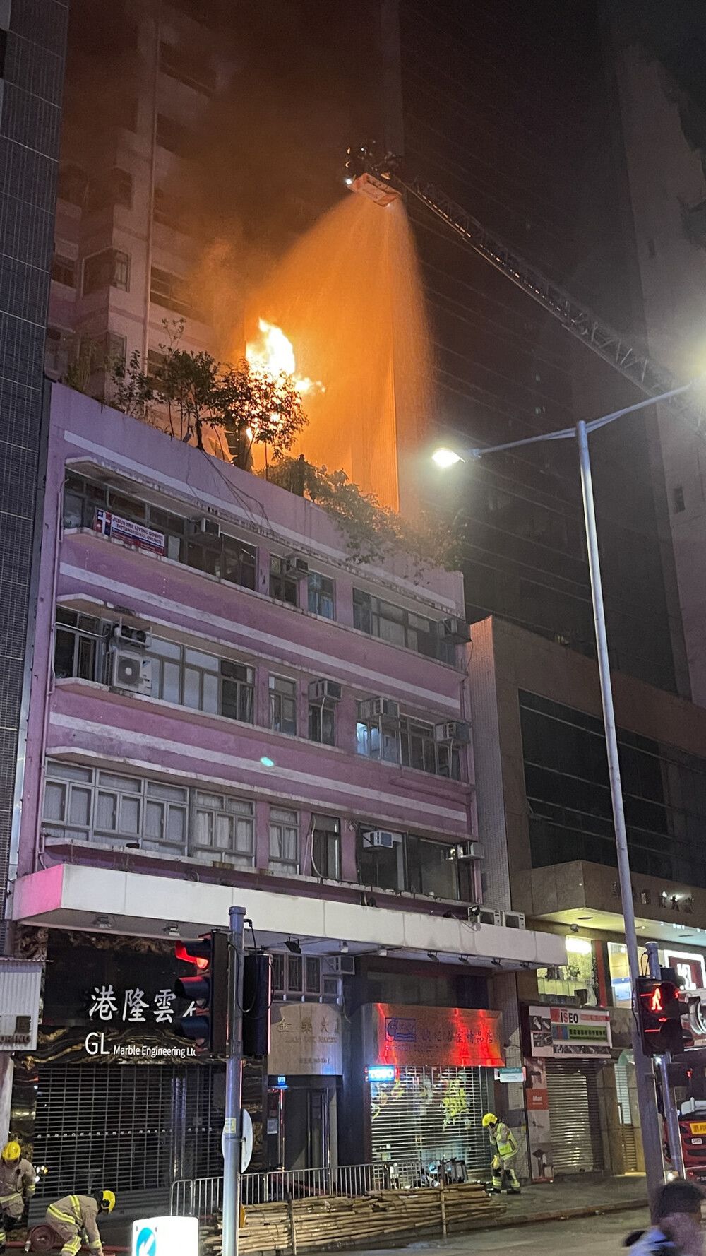Suspicious Wan Chai fire leaves father and son dead, one with stab wounds