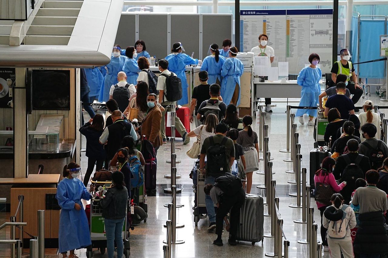 Hong Kong axes COVID tests on arrival, most remaining rules