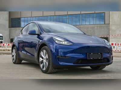 Record output for Tesla but deliveries still below estimates