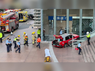 Taxi collision with escalator injures two