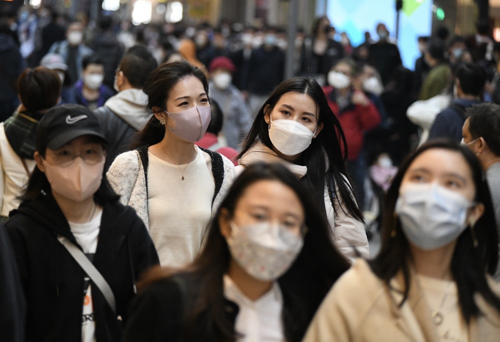 Hong Kong to consider lifting mask mandate after winter flu threat