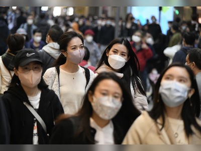 Hong Kong to consider lifting mask mandate after winter flu threat