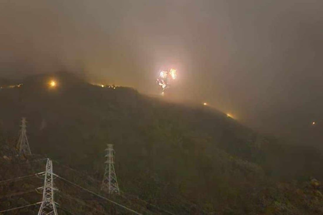 Scores of people trapped in lifts as blast at Hong Kong pylon disrupts power