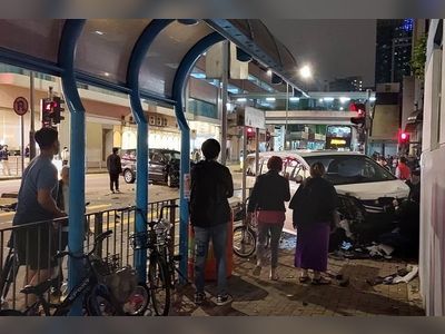 Hong Kong pedestrian pinned against wall as car mounts pavement after crash