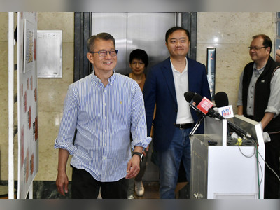Paul Chan buys food for patrons with consumption voucher; expects scheme to boost economy by 0.6pc