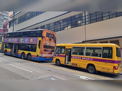 Three people injured as school bus crashes into double decker in Central