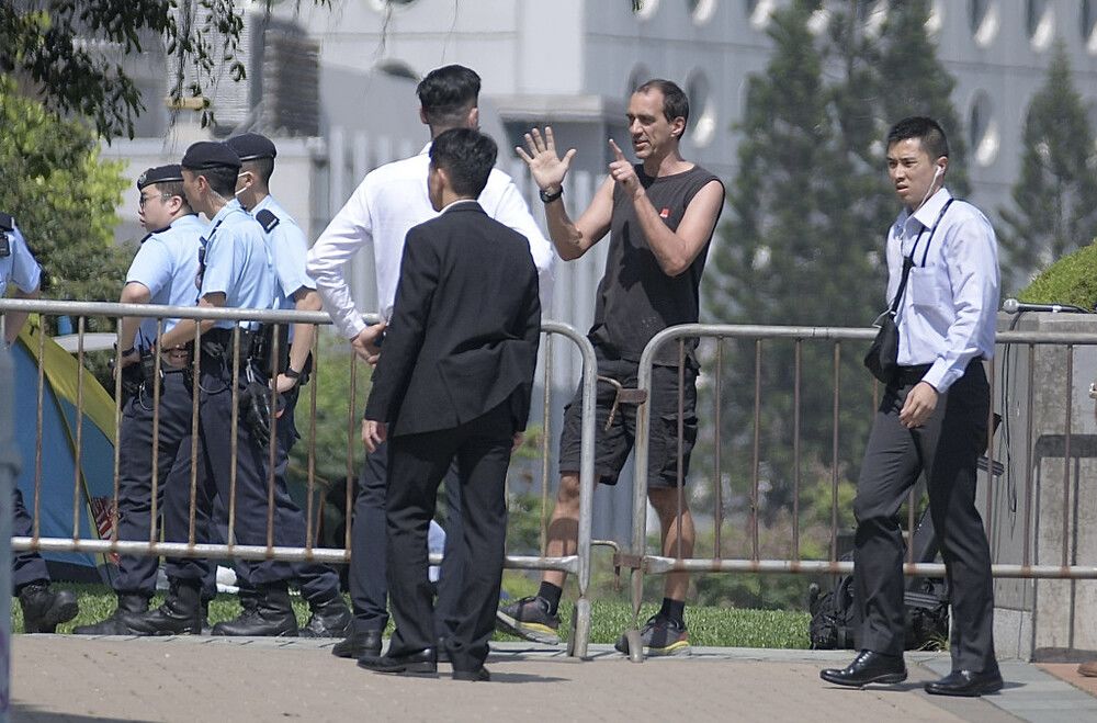 Foreigner taken away over one-man protest outside LegCo complex