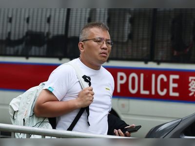 Hong Kong officer denies exaggerating evidence in trial of journalist union head